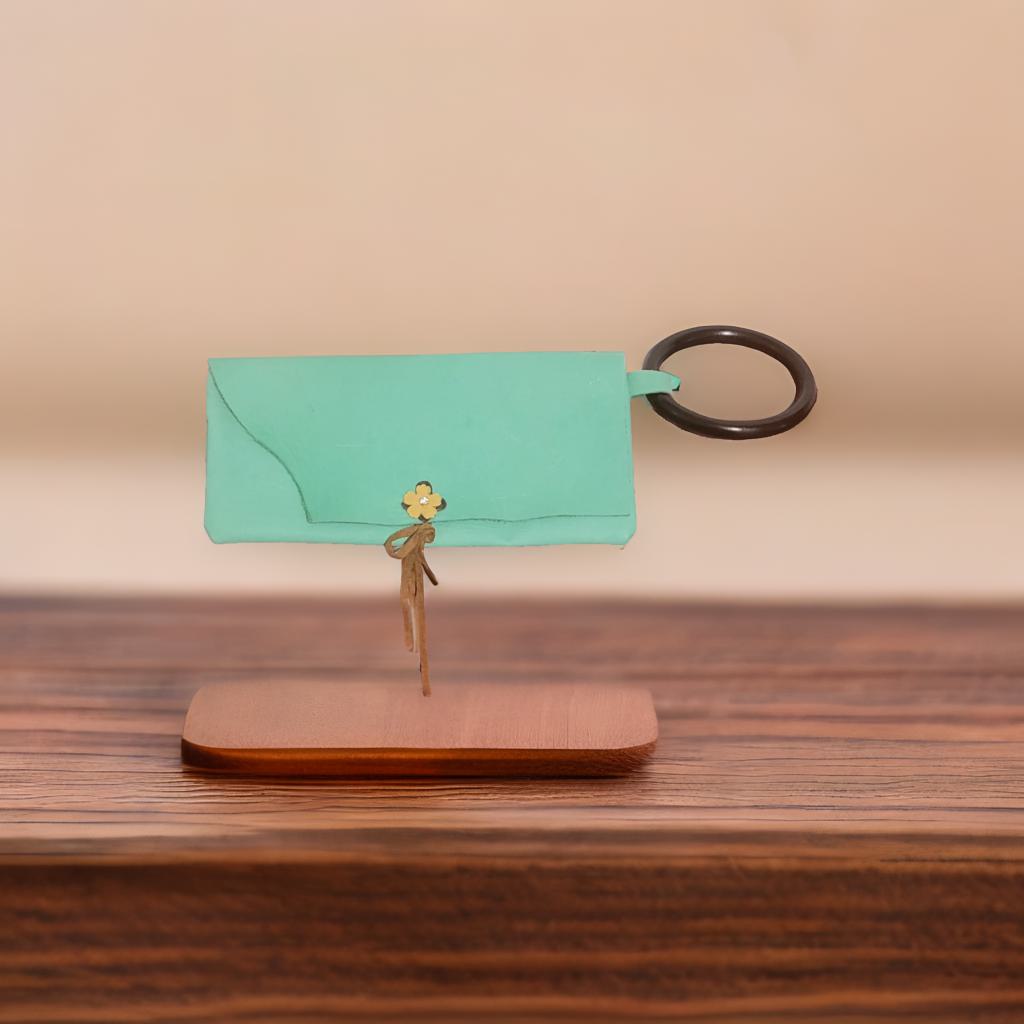 Light green leather clutch with wood handle